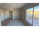 Well-lit bedroom with mirrored closet and tile flooring at 5453 Requa Ave, Las Vegas, NV 89110