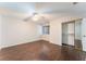 Spacious bedroom with wood-look floors and mirrored closet at 5453 Requa Ave, Las Vegas, NV 89110