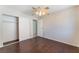 Spacious bedroom with mirrored closet doors and wood floors at 5453 Requa Ave, Las Vegas, NV 89110