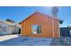 Orange house exterior with a driveway at 5453 Requa Ave, Las Vegas, NV 89110