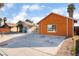 Orange house with a driveway and side yard view at 5453 Requa Ave, Las Vegas, NV 89110