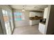 Kitchen with view of pool, white cabinets, and tile floor at 5453 Requa Ave, Las Vegas, NV 89110