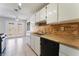 Kitchen area featuring stainless steel sink, neutral cabinets and a window above at 5453 Requa Ave, Las Vegas, NV 89110