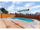 Kidney-shaped swimming pool with surrounding concrete patio at 5453 Requa Ave, Las Vegas, NV 89110