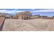 Large backyard with gravel and a two-story house at 5520 Acadia Leaf St, Las Vegas, NV 89149