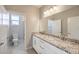 Clean bathroom with double vanity and granite countertop at 5520 Acadia Leaf St, Las Vegas, NV 89149