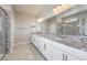 Elegant bathroom featuring double vanity and granite countertops at 5520 Acadia Leaf St, Las Vegas, NV 89149