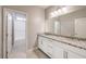 Modern bathroom with double vanity and granite countertop at 5520 Acadia Leaf St, Las Vegas, NV 89149