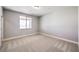 Bright bedroom with carpeted floor and window at 5520 Acadia Leaf St, Las Vegas, NV 89149