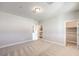 Spacious bedroom with carpet, en-suite bathroom, and walk-in closet at 5520 Acadia Leaf St, Las Vegas, NV 89149