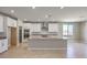 Modern kitchen with island, stainless steel appliances and granite countertops at 5520 Acadia Leaf St, Las Vegas, NV 89149