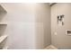 Simple laundry room with shelving and hookups at 5520 Acadia Leaf St, Las Vegas, NV 89149