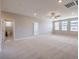 Spacious loft area with carpet and ceiling fan at 5520 Acadia Leaf St, Las Vegas, NV 89149