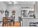 Well-lit dining area with wood table and chairs near kitchen at 5751 E Hacienda Ave # 232, Las Vegas, NV 89122