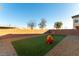 Spacious backyard with artificial turf, perfect for play at 5824 Petrified Tree Ln, North Las Vegas, NV 89081