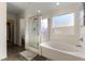 Bathroom with shower, soaking tub and tile flooring at 5824 Petrified Tree Ln, North Las Vegas, NV 89081