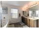 Bathroom with double vanity, soaking tub and shower at 5824 Petrified Tree Ln, North Las Vegas, NV 89081