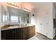 Bathroom with double vanity and granite countertops at 5824 Petrified Tree Ln, North Las Vegas, NV 89081