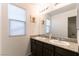 Bathroom with double vanity and granite countertop at 5824 Petrified Tree Ln, North Las Vegas, NV 89081