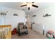 Bedroom with rocking chair and dresser, overlooking another room at 5824 Petrified Tree Ln, North Las Vegas, NV 89081