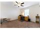 Bright bedroom with built-in desk and carpeted floor at 5824 Petrified Tree Ln, North Las Vegas, NV 89081