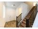 Bright entryway with tile floors and wooden staircase at 5824 Petrified Tree Ln, North Las Vegas, NV 89081