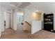 Upstairs hallway with carpet and access to bedrooms at 5824 Petrified Tree Ln, North Las Vegas, NV 89081