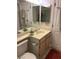 Bathroom with a vanity, toilet and a large mirror at 601 Cabrillo Cir # 323, Henderson, NV 89015