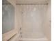 Bathroom with a shower/tub combo and clear shower curtain at 601 Cabrillo Cir # 323, Henderson, NV 89015