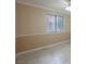 Neutral-toned bedroom with tile floors and a window with blinds at 601 Cabrillo Cir # 323, Henderson, NV 89015