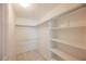 Large walk-in closet with shelving and hanging rods at 601 Cabrillo Cir # 323, Henderson, NV 89015