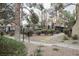 Landscaped walkway with lush greenery and trees at 601 Cabrillo Cir # 323, Henderson, NV 89015