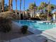 Inviting community pool with surrounding landscaping at 601 Cabrillo Cir # 323, Henderson, NV 89015