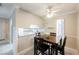 Dining area with table and chairs, kitchen passthrough, and patio view at 601 Cabrillo Cir # 323, Henderson, NV 89015