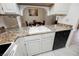 Kitchen features a large sink and dishwasher at 601 Cabrillo Cir # 323, Henderson, NV 89015