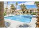 Inviting community pool with lounge chairs and shaded areas at 601 Cabrillo Cir # 323, Henderson, NV 89015