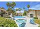 Community pool and spa with lounge chairs and landscaping at 601 Cabrillo Cir # 323, Henderson, NV 89015