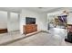 Living room, tiled floors, and view of kitchen at 6133 Meadowgrass Ln, Las Vegas, NV 89103