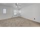 Spacious bedroom with ceiling fan and large window at 6285 Crusted Dome Ct, Las Vegas, NV 89139