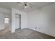 Well-lit bedroom with a ceiling fan and carpet flooring at 6285 Crusted Dome Ct, Las Vegas, NV 89139