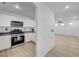 Modern kitchen with white cabinets, stainless steel appliances, and light flooring at 6285 Crusted Dome Ct, Las Vegas, NV 89139