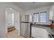 Modern kitchen with stainless steel appliances and white cabinets at 6285 Crusted Dome Ct, Las Vegas, NV 89139