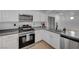 Modern kitchen with stainless steel appliances and white cabinets at 6285 Crusted Dome Ct, Las Vegas, NV 89139