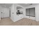 Open living room and kitchen with light wood flooring at 6285 Crusted Dome Ct, Las Vegas, NV 89139