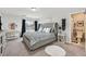 Spacious bedroom with plush bed, ensuite bathroom, and ample natural light at 6456 Grande River Ct, Las Vegas, NV 89139