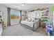 Fun bedroom with a daybed and extensive toy storage shelving at 6456 Grande River Ct, Las Vegas, NV 89139