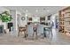 Open concept dining area with modern table and chairs at 6456 Grande River Ct, Las Vegas, NV 89139