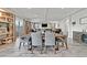 Bright dining room with a large table and built-in shelving at 6456 Grande River Ct, Las Vegas, NV 89139