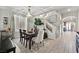 Elegant dining room features a charming chandelier and hardwood floors at 6456 Grande River Ct, Las Vegas, NV 89139