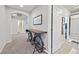 A charming hallway with unique decor and access to bedrooms and baths at 6456 Grande River Ct, Las Vegas, NV 89139